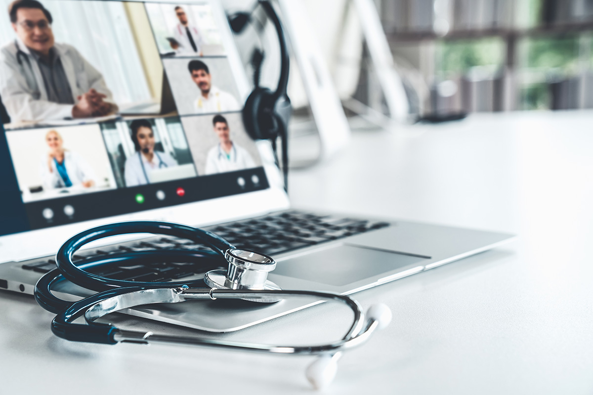 Digital screens feature virtual presenters and attendees.